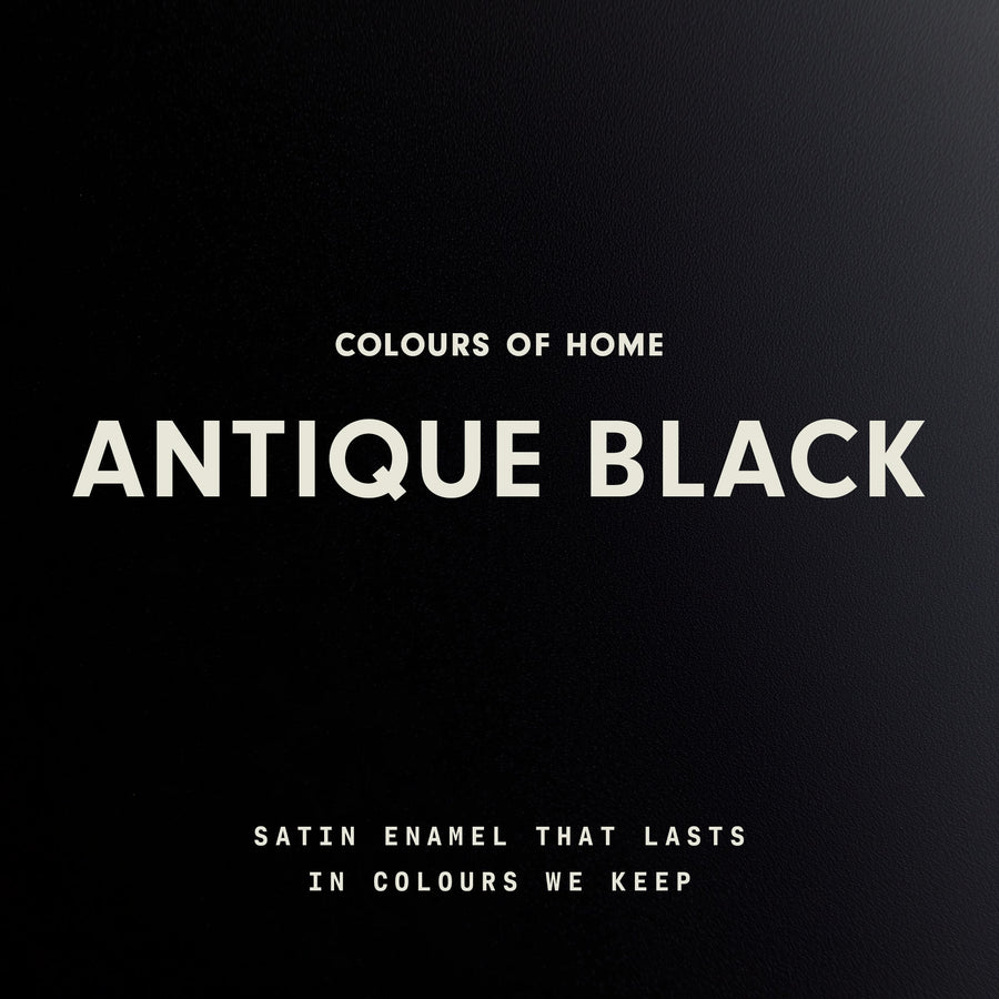 A close up of smooth black satin enamel with the words “Colours of Home” at the top, “Antique Black” in large bold text in the centre, and the line “Satin enamel that lasts in colours we keep” at the bottom.