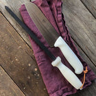 Ironclad knife steel plus Santoku knife sitting together on a table